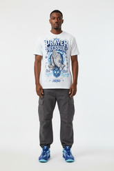 Male model wearing Prayer Pressure graphic tee with Nike Zoom Kobe 5 Protro X-Ray sneakers