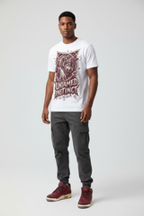 Mockup - Untamed Instinct Graphic Tee worn by male model with Air Jordan 3 Bin23