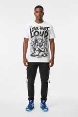 Male model wearing Love Hurt Loud graphic tee with Nike Zoom Kobe 5 Protro X-Ray sneakers