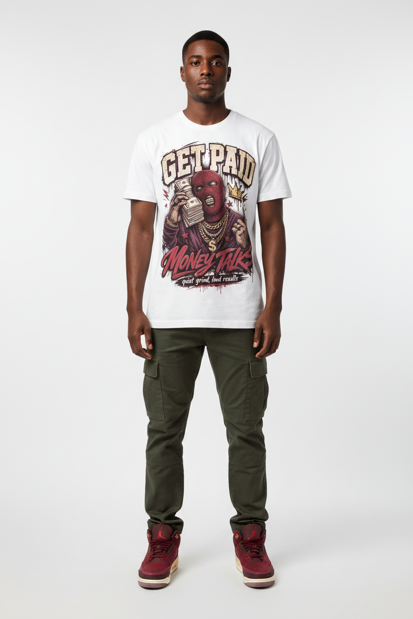 Male model wearing Get Paid Money Talk Zadago graphic tee with Air Jordan 3 Bin23 sneakers, studio background