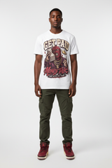 Male model wearing Get Paid Money Talk Zadago graphic tee with Air Jordan 3 Bin23 sneakers, studio background