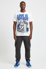 Male model wearing Love Is Expensive graphic tee with Nike Zoom Kobe 5 Protro X-Ray sneakers