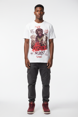 Male model wearing All Hustle No Luck Zadago graphic tee with Air Jordan 3 Bin23 sneakers, studio background