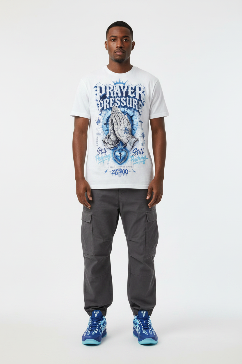 Male model wearing Prayer Pressure graphic tee with Nike Zoom Kobe 5 Protro X-Ray sneakers