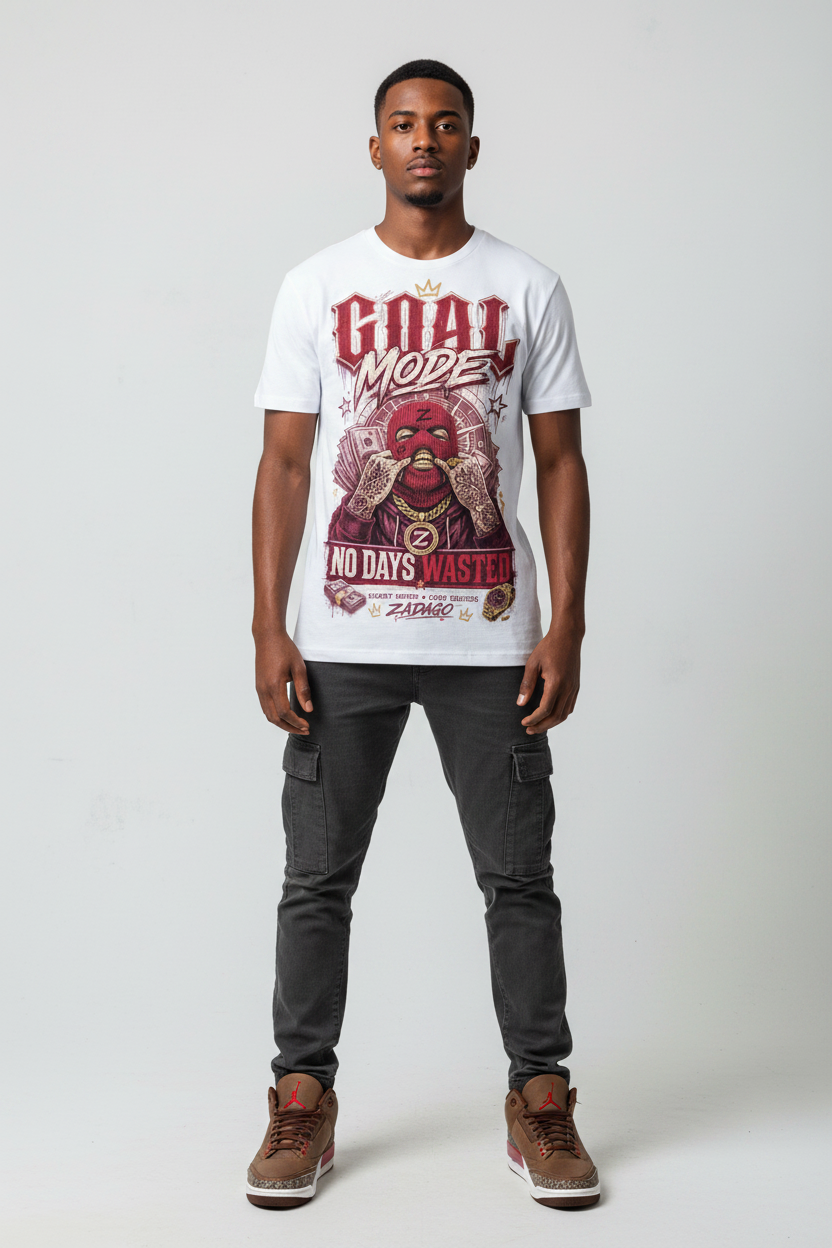 Male model wearing Goal Mode No Days Wasted Zadago graphic tee with Air Jordan 3 Bin23 sneakers, studio background