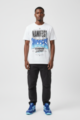 Male model wearing Manifest Success graphic tee with Nike Zoom Kobe 5 Protro X-Ray sneakers