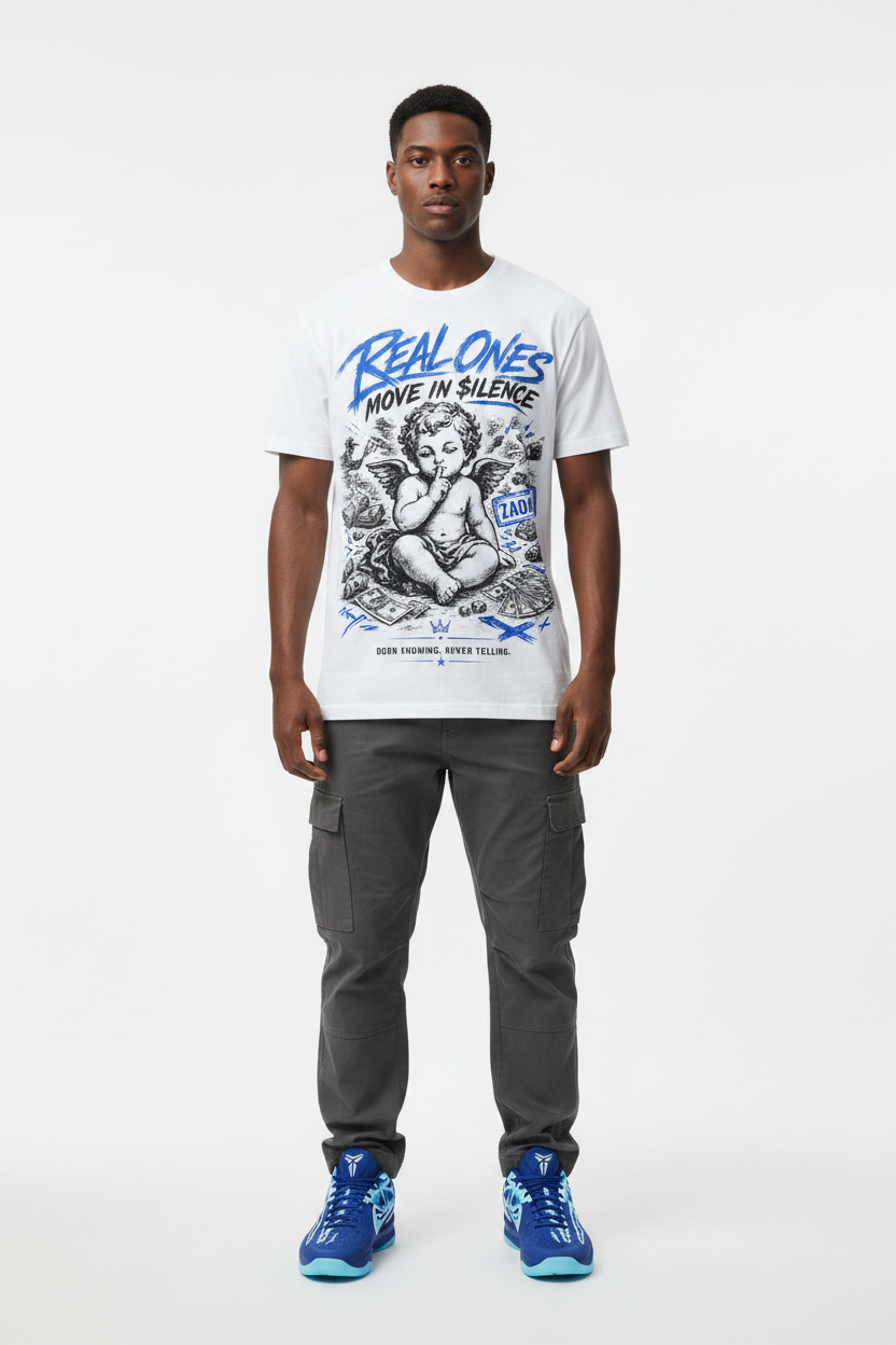 Male model wearing Real Ones Move In Silence graphic tee with Nike Zoom Kobe 5 Protro X-Ray sneakers
